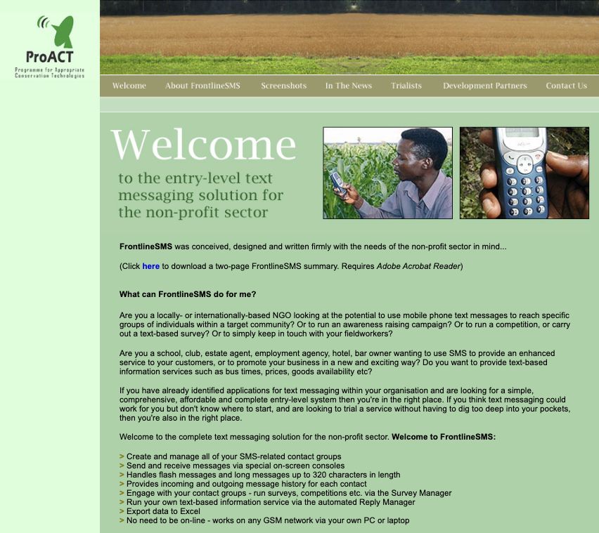 The first FrontlineSMS website home page, with a banner photograph of trees across a field