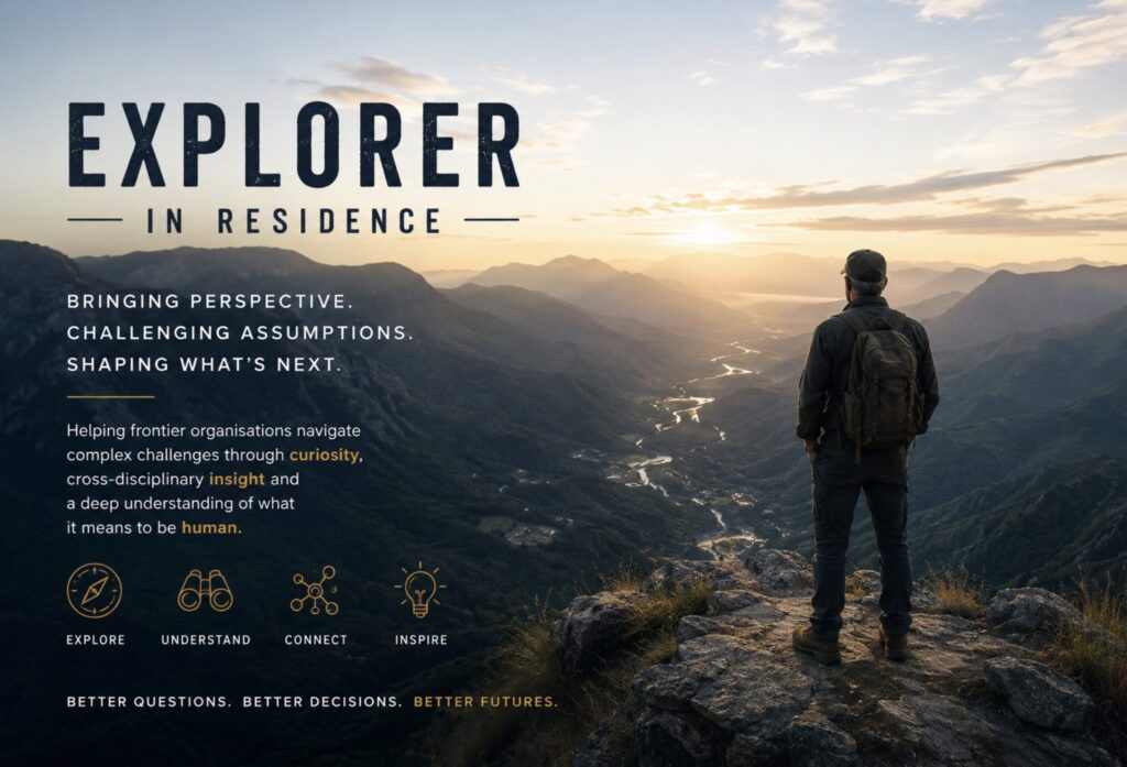 Explorer in Residence: a hiker with a backpack looks out over a mountain valley at sunrise